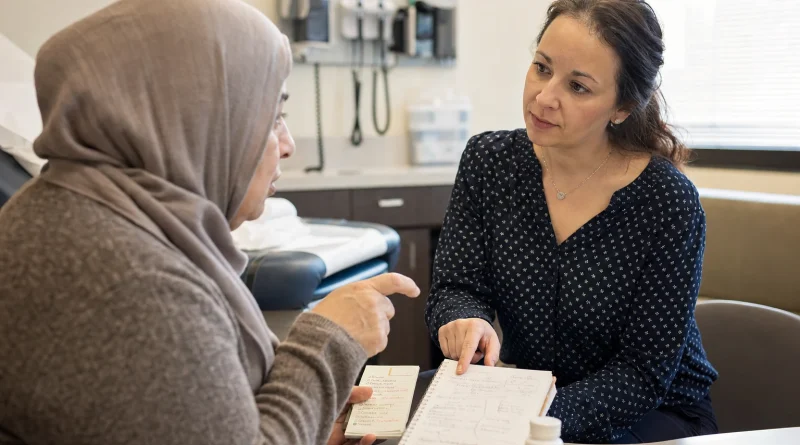 A patient uses a concise concern list while speaking with her physician during an appointment